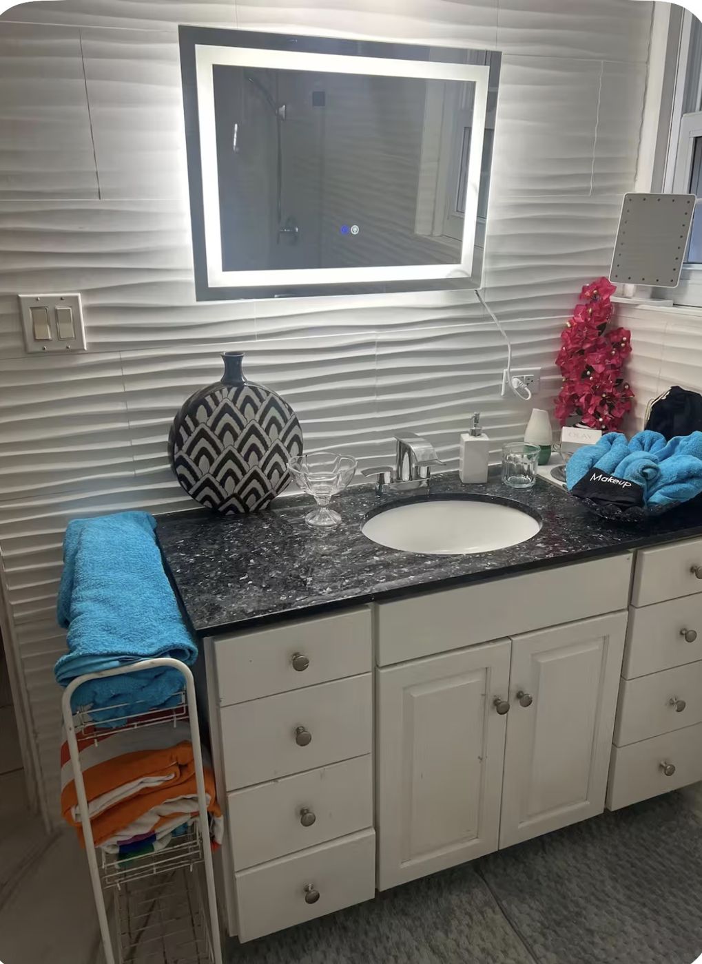 Vanity with granite top and backlit LED mirror