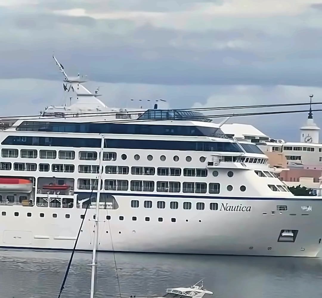 Cruise ship docking in Hamilton Harbour, seen from Aqua Viva, with a sailboat and yacht in front