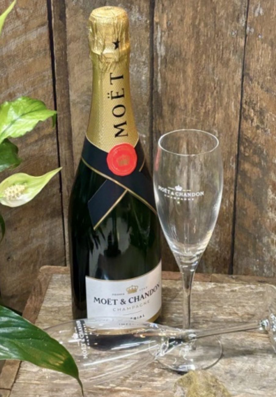 Bottle of Moët & Chandon champagne with two flutes