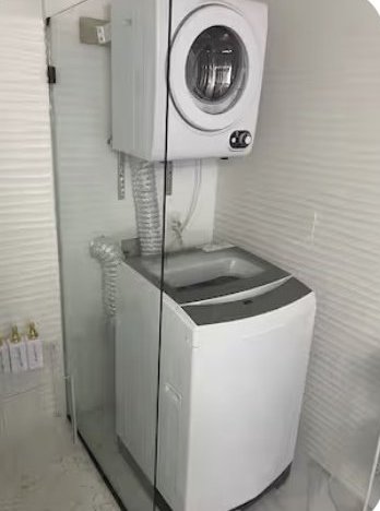 Stacked washer and wall-mounted dryer in the bathroom